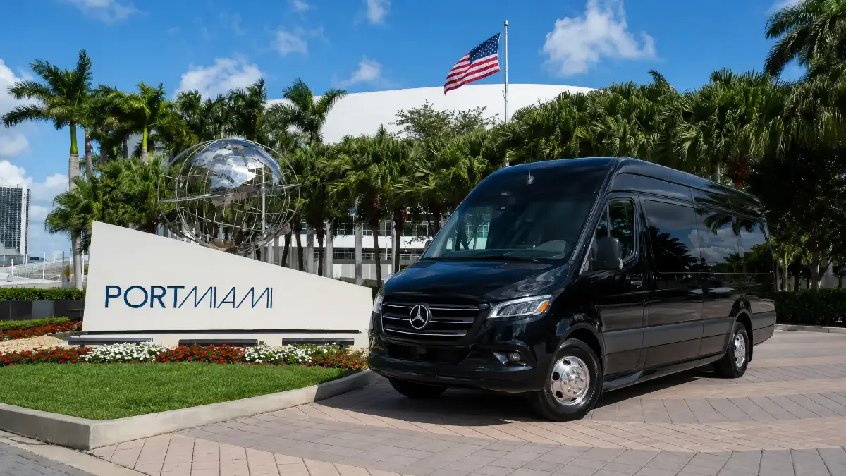 Miami Port Shuttles vehicle beside the PortMiami entrance sign